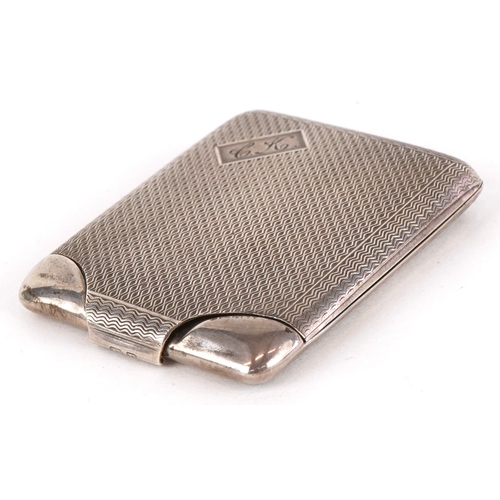 3614 - An Art Deco engine turned silver matchbook case, possibly Birmingham 1930, 6cm in length, 23.9g.