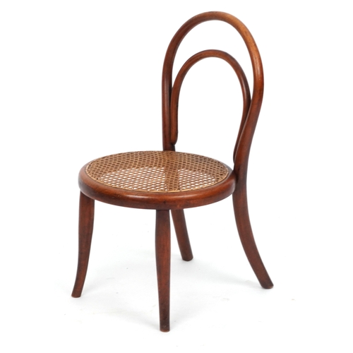 2146 - An early 20th century child's bentwood chair by Thonet, the cane seat raised on tapering legs, 59cm ... 