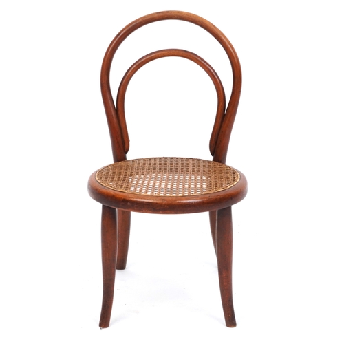 2146 - An early 20th century child's bentwood chair by Thonet, the cane seat raised on tapering legs, 59cm ... 