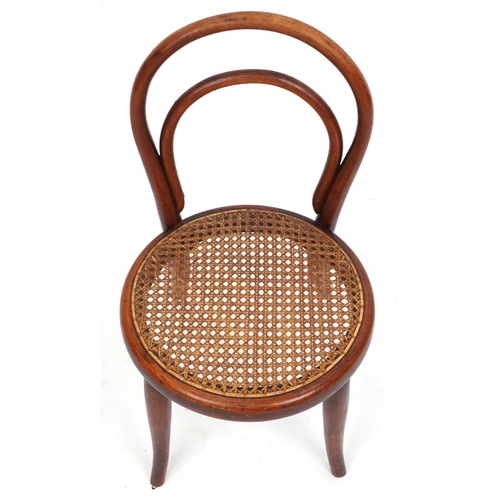 2146 - An early 20th century child's bentwood chair by Thonet, the cane seat raised on tapering legs, 59cm ... 