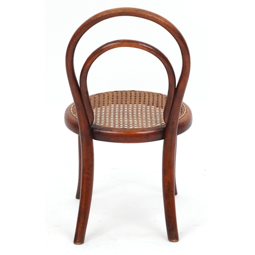 2146 - An early 20th century child's bentwood chair by Thonet, the cane seat raised on tapering legs, 59cm ... 