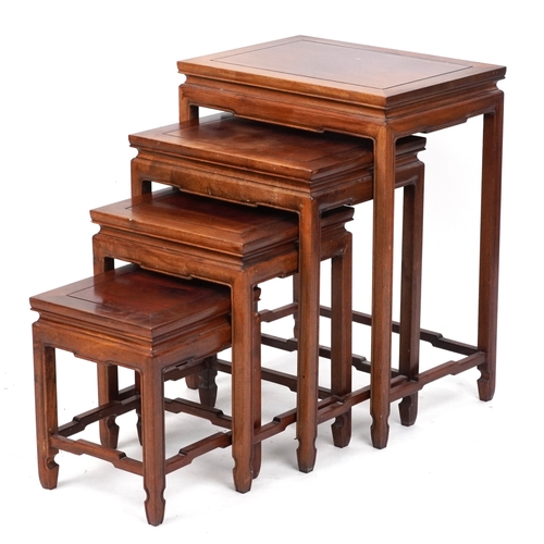 2151 - A Chinese hardwood quartetto nest of occasional tables, 20th century, raised on block legs, 65cm H x... 