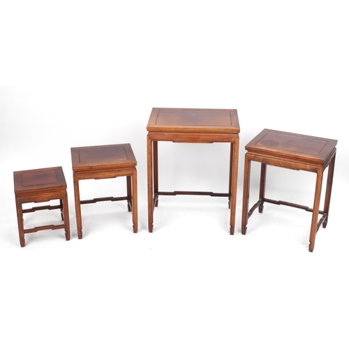 2151 - A Chinese hardwood quartetto nest of occasional tables, 20th century, raised on block legs, 65cm H x... 