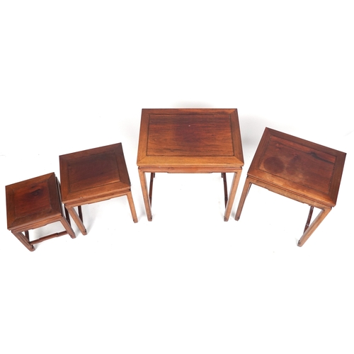 2151 - A Chinese hardwood quartetto nest of occasional tables, 20th century, raised on block legs, 65cm H x... 