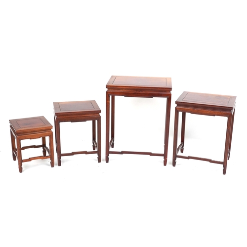 2151 - A Chinese hardwood quartetto nest of occasional tables, 20th century, raised on block legs, 65cm H x... 