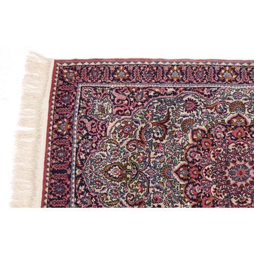 2219 - A Turkish rug, late 20th century, the pink field with a central stylized medallion within a compleme... 