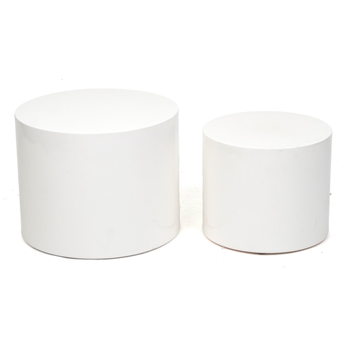 2050 - A pair of late 20th century white fibreglass cylindrical nesting tables, 38cm high x 48cm in diamete... 