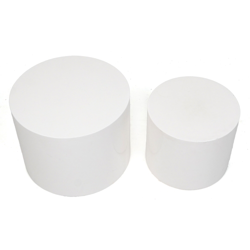 2050 - A pair of late 20th century white fibreglass cylindrical nesting tables, 38cm high x 48cm in diamete... 