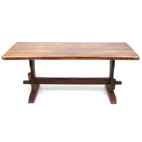 2127 - A 20th century oak refectory table, the rectangular top raised on shaped supports and bracket feet, ... 