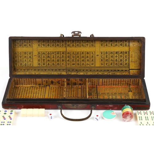 561 - A 20th century Chinese Mahjong set housed in a fitted case, 43.5cm wide.