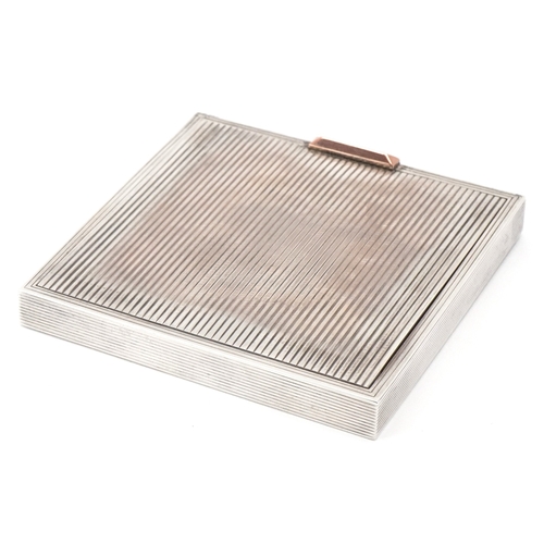 38 - David Sutton & Sons, an Art Deco style engine turned silver compact, London circa 1946-1951, 7.5cm x... 