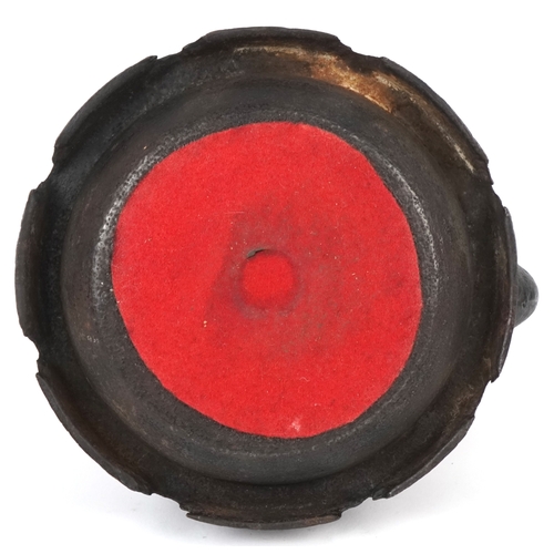  A Japanese cast iron teapot, 19th century, decorated with a phoenix bearing a nine character mark to... 