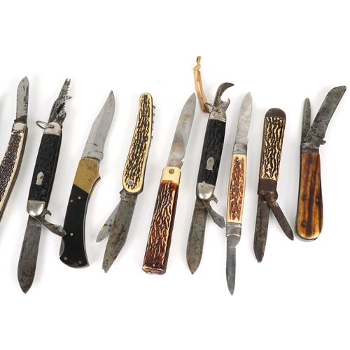 538 - A collection of pocket knives and tools including horn design examples, the largest 12cm in length.