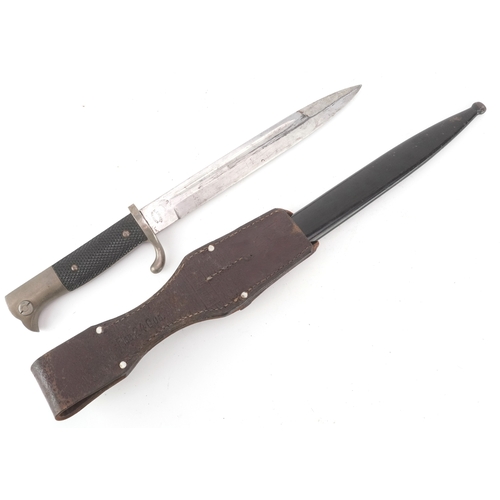 2847 - A German military interest bayonet and scabbard with a leather frog, the blade engraved A Evertz Sol... 