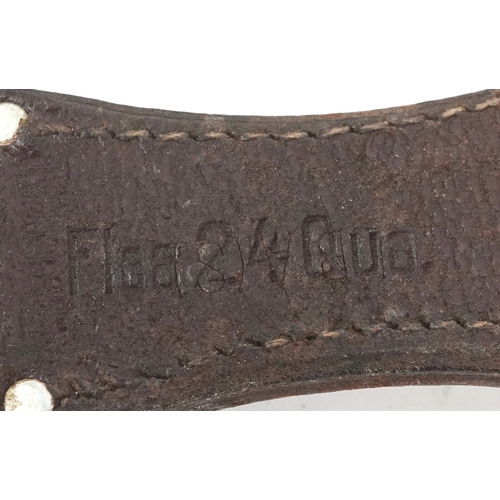 2847 - A German military interest bayonet and scabbard with a leather frog, the blade engraved A Evertz Sol... 