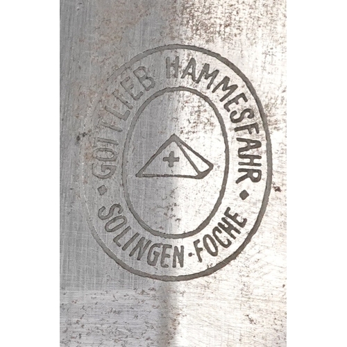 2845 - A German military interest fighting dagger and sheath, 37cm in length.