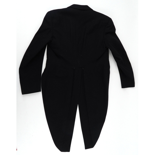 1033 - A collection of theatre costumes including a boned petticoat skirt, a tail coat, ladies dresses and ... 