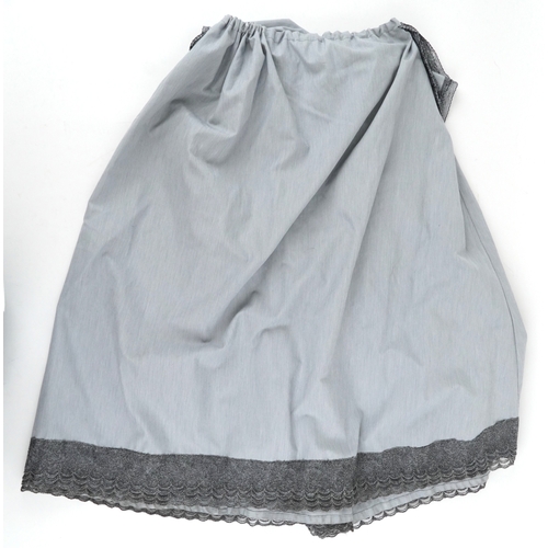 1033 - A collection of theatre costumes including a boned petticoat skirt, a tail coat, ladies dresses and ... 