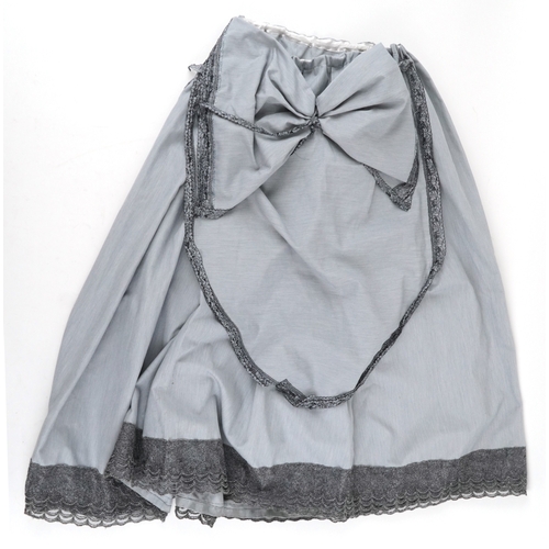 1033 - A collection of theatre costumes including a boned petticoat skirt, a tail coat, ladies dresses and ... 