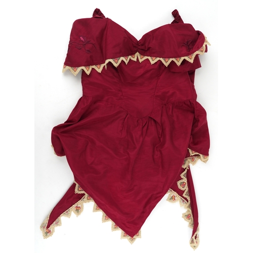 1033 - A collection of theatre costumes including a boned petticoat skirt, a tail coat, ladies dresses and ... 