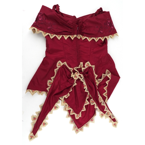 1033 - A collection of theatre costumes including a boned petticoat skirt, a tail coat, ladies dresses and ... 