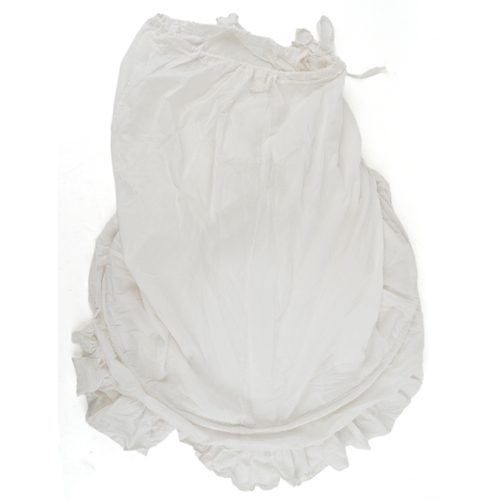 1033 - A collection of theatre costumes including a boned petticoat skirt, a tail coat, ladies dresses and ... 