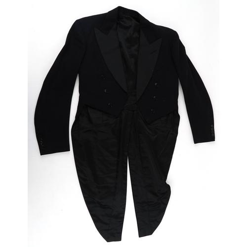 1033 - A collection of theatre costumes including a boned petticoat skirt, a tail coat, ladies dresses and ... 