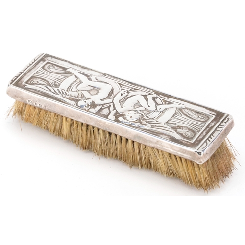 47 - Elkington & Co., an Edwardian silver mounted clothes brush embossed with Putti, Birmingham 1908, 18c... 