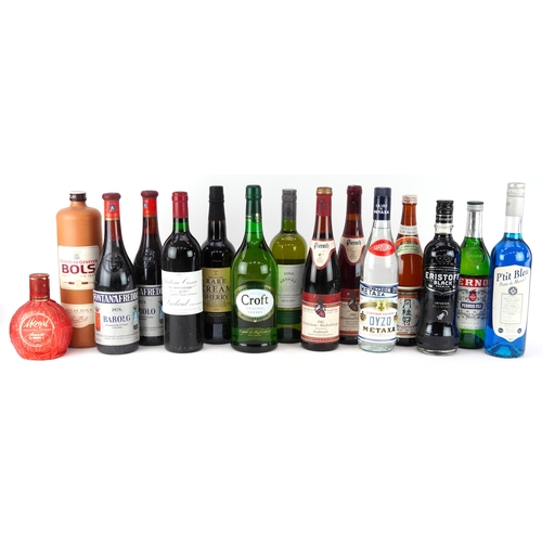 19 - Fifteen bottles of alcohol including Oyzo, Pernod, 1983 Kallstadter Feuerberg and Château Lissac 198... 