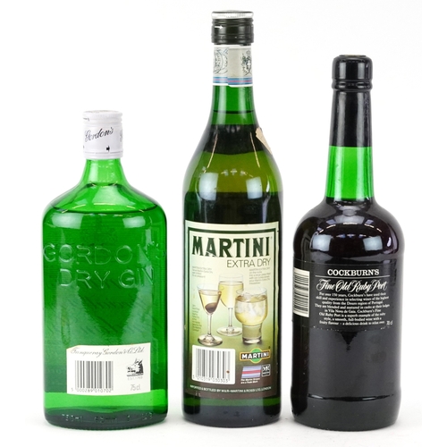11 - Three bottles of alcohol comprising Cockburn's Fine Old Ruby port, Gordon's Special Dry London gin a... 