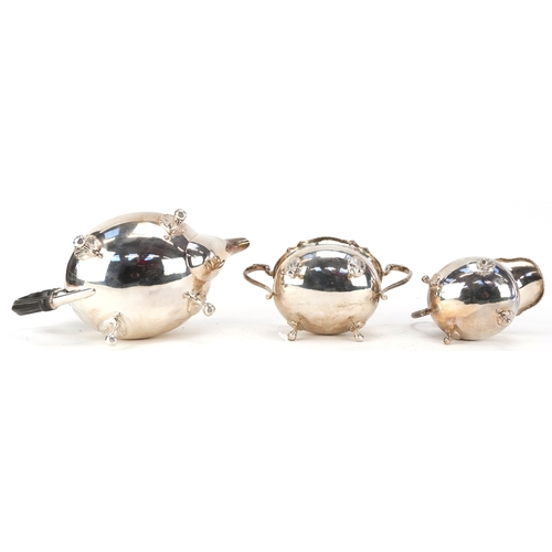 24 - Mappin & Webb, a George V silver three piece tea service raised on ball and claw feet, Sheffield 191... 