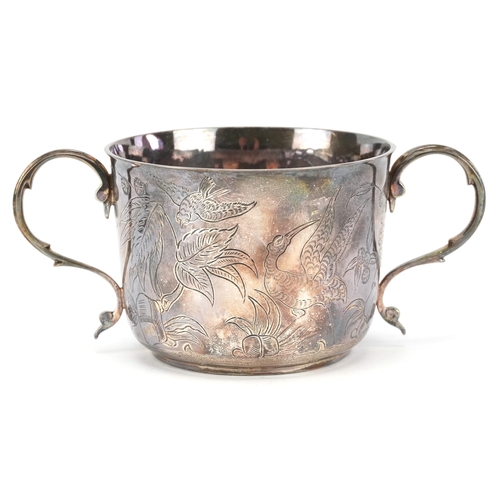 57 - The Goldsmiths & Silversmiths Company, a George V silver twin handled christening cup and spoon engr... 