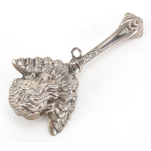 43 - A silver babies rattle in the form of a cherub, London import mark 1994, 12cm in length, 29.1g.