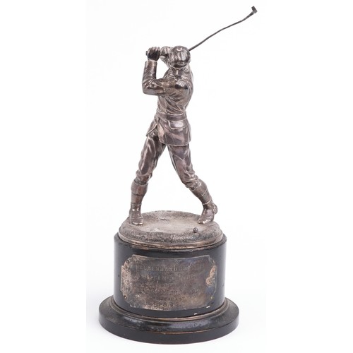 30 - A good Victorian silver figural trophy in the form of a male golfer in mid swing, raised on an eboni... 