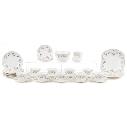 679 - An Art Deco Shelley tea service hand painted with flowers including milk jug, sugar bowl and trios, ... 