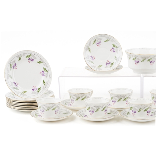 679 - An Art Deco Shelley tea service hand painted with flowers including milk jug, sugar bowl and trios, ... 
