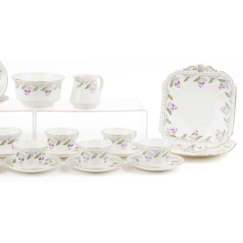 679 - An Art Deco Shelley tea service hand painted with flowers including milk jug, sugar bowl and trios, ... 