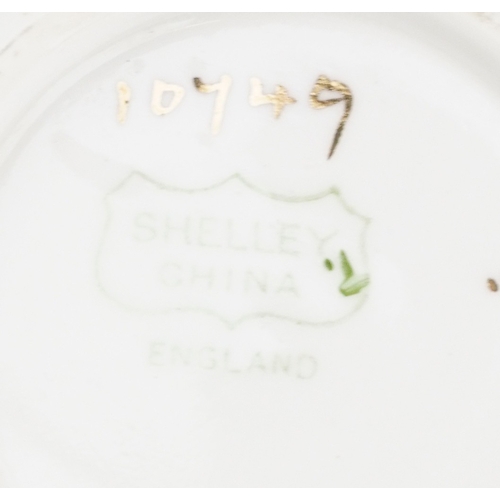 679 - An Art Deco Shelley tea service hand painted with flowers including milk jug, sugar bowl and trios, ... 