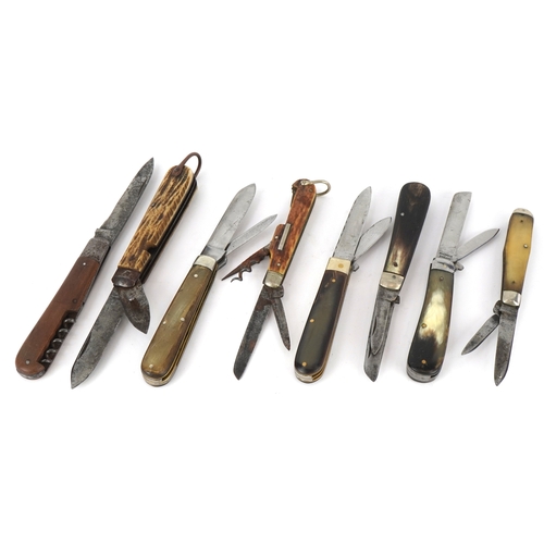 539 - A collection of folding pocket knives and tools with bone and wood flanked handles, the largest 12cm... 