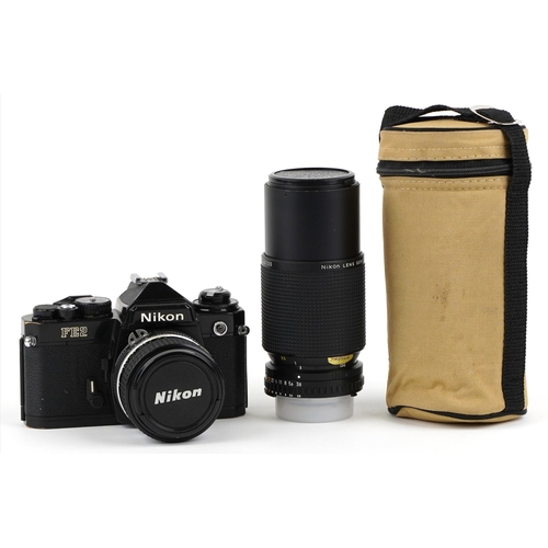 1051 - A Nikon FE2 camera with lens and a 75-150 lens