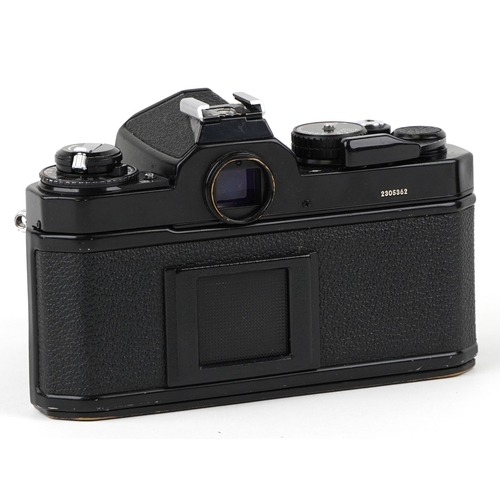 1051 - A Nikon FE2 camera with lens and a 75-150 lens