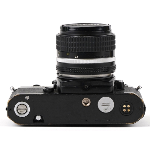 1051 - A Nikon FE2 camera with lens and a 75-150 lens