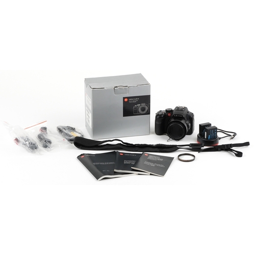  A Leica V Lux 4 camera with box and accessories.