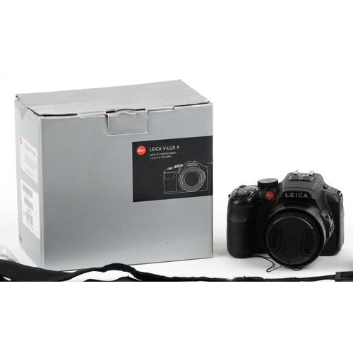 A Leica V Lux 4 camera with box and accessories.