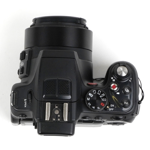  A Leica V Lux 4 camera with box and accessories.