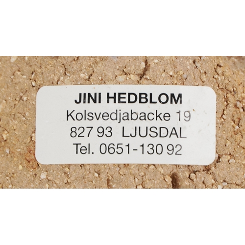 477 - Jini Hedblom, a set of four Swedish studio pottery wall hanging candlesticks, 45cm high.