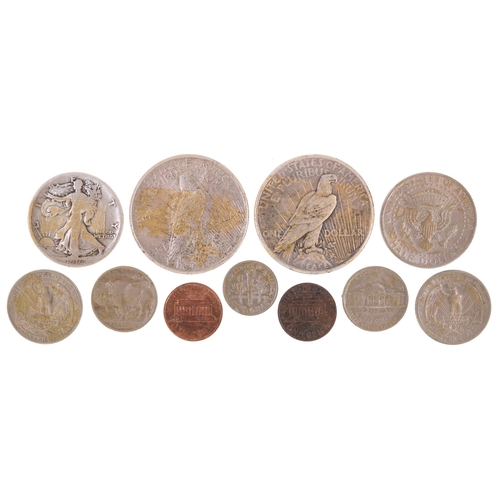 1078 - A small quantity of silver and white metal American coinage including two silver Liberty dollars dat... 