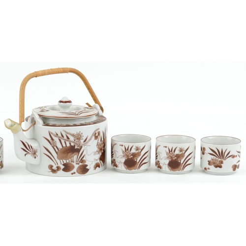 1580 - A Chinese porcelain six place tea service with teapot decorated with storks and foliage, the teapot ... 