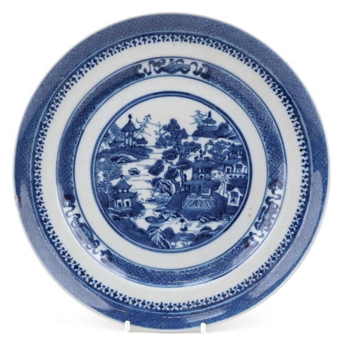 1574 - A Chinese blue and white porcelain plate hand painted with a rural landscape, 25cm in diameter.