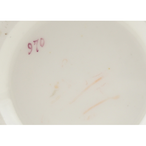 35 - A pair of 19th century, possibly Nantgarw, porcelain spill vases, each hand painted with a bird perc... 